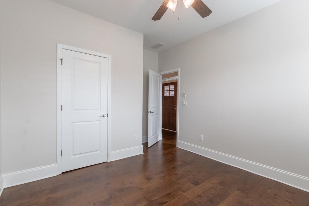 601 Cork Street Woodstock, GA 30188 - Photo 36 of 52 an empty room with closet and a ceiling fan
