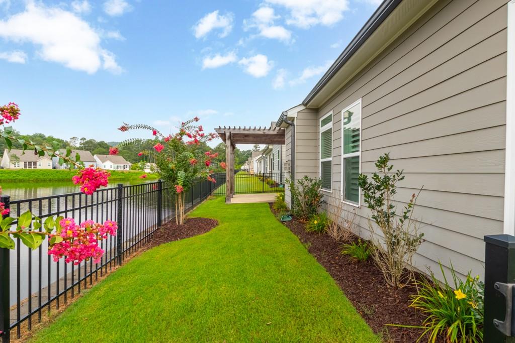 601 Cork Street Woodstock, GA 30188 - Photo 46 of 52 a view of a house with backyard and a garden