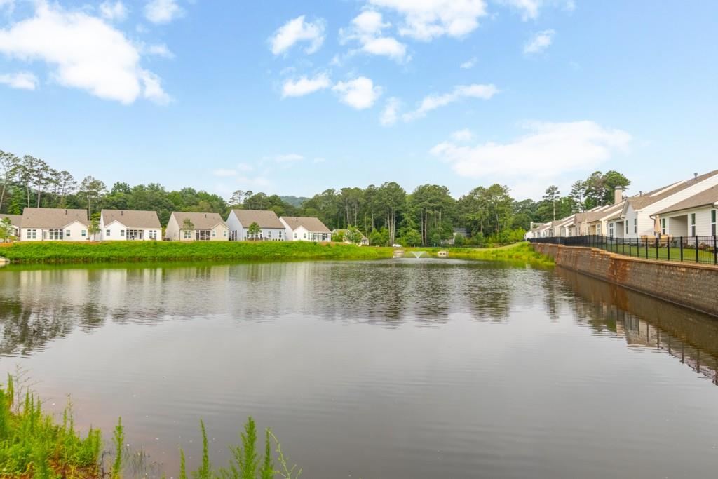 601 Cork Street Woodstock, GA 30188 - Photo 50 of 52 a view of a lake with houses in the back