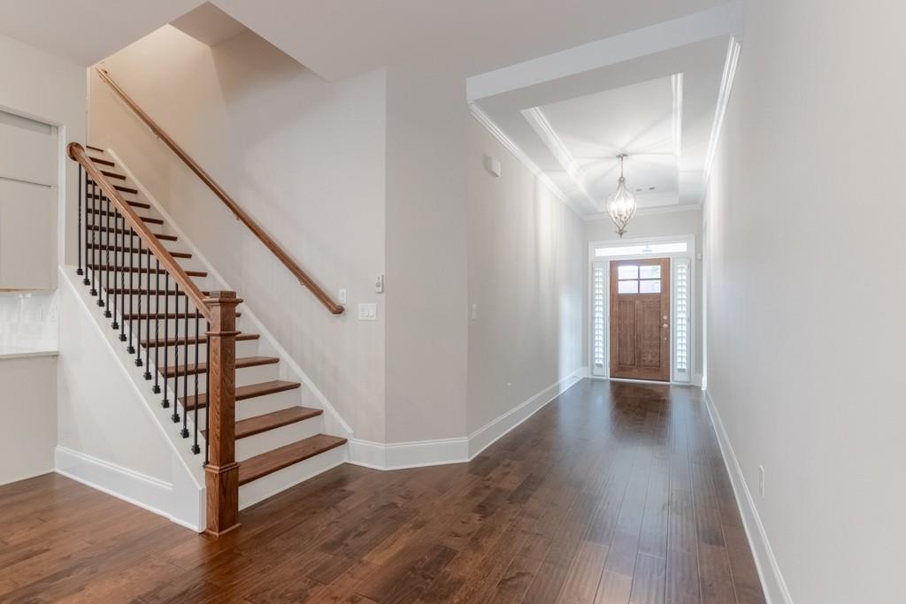 601 Cork Street Woodstock, GA 30188 - Photo 5 of 52 a view of a hallway with wooden floor and entryway