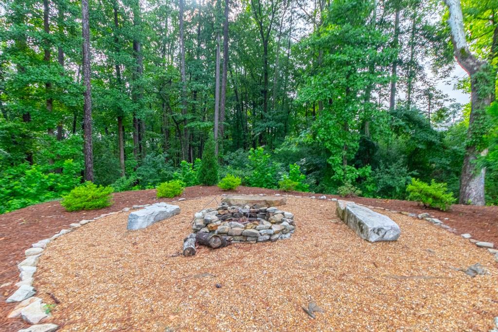 601 Cork Street Woodstock, GA 30188 - Photo 52 of 52 a wooden bench with view of trees