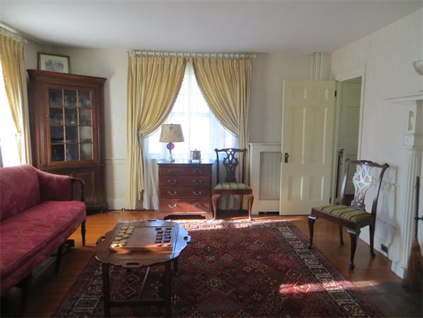 151 Edgell Road Framingham, MA 01701 - Photo 21 of 27 a living room with furniture and a fireplace