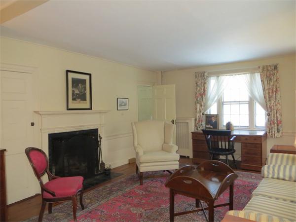 151 Edgell Road Framingham, MA 01701 - Photo 23 of 27 a living room with furniture a fireplace and a large window