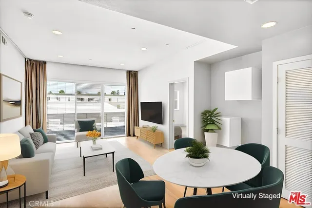 a living room with furniture and a table