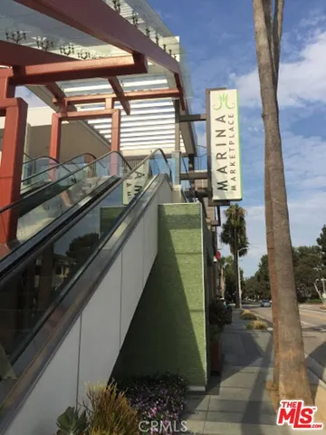 a view of a building and a people on a street