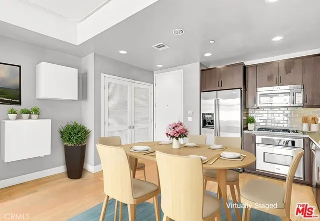 a kitchen with a table and chairs in it