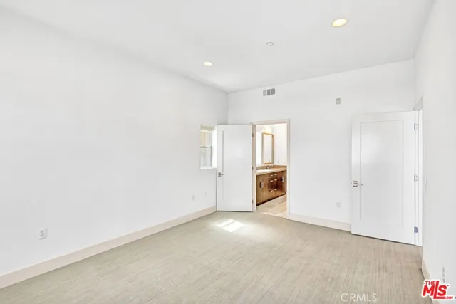 a view of a livingroom with kitchen