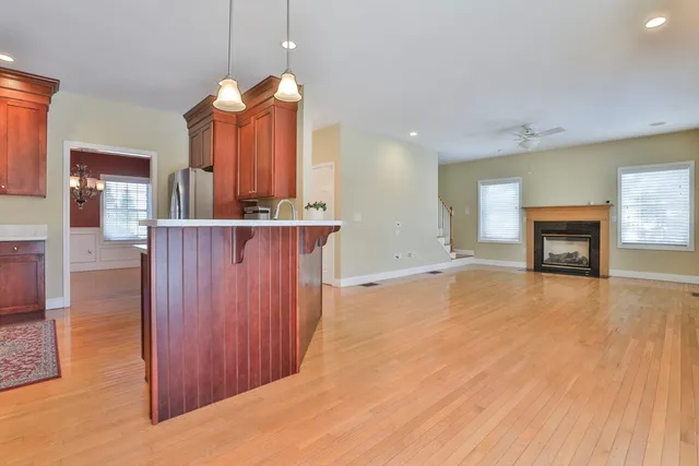 a view of a kitchen and a fireplace