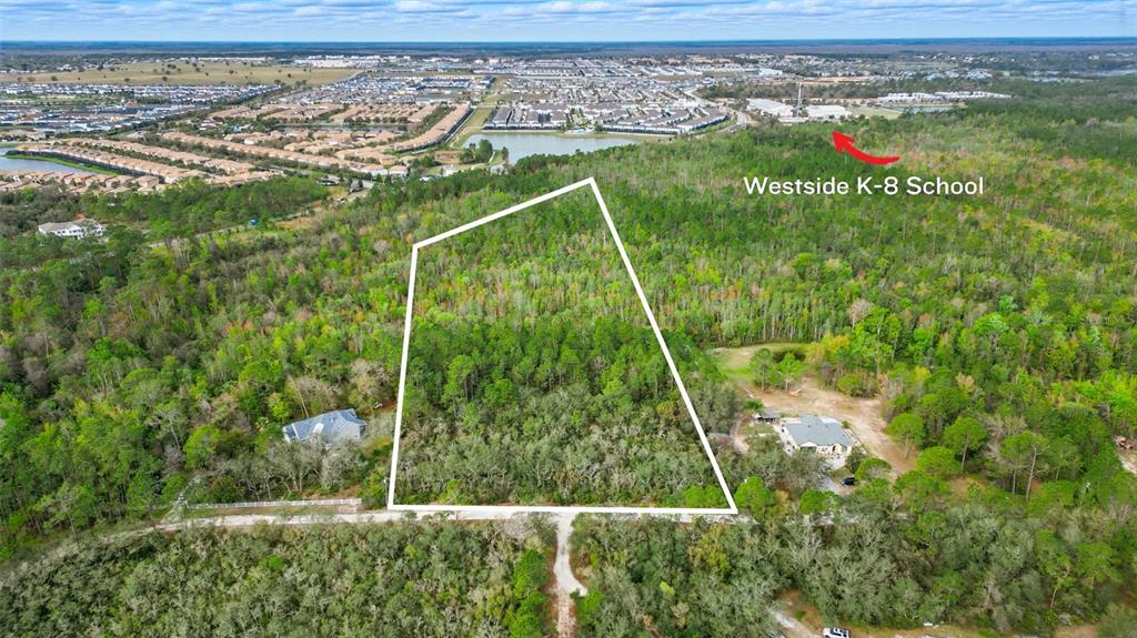 Thacker Trail Kissimmee, FL 34747 - Photo 4 of 11 a view of a yard from a balcony
