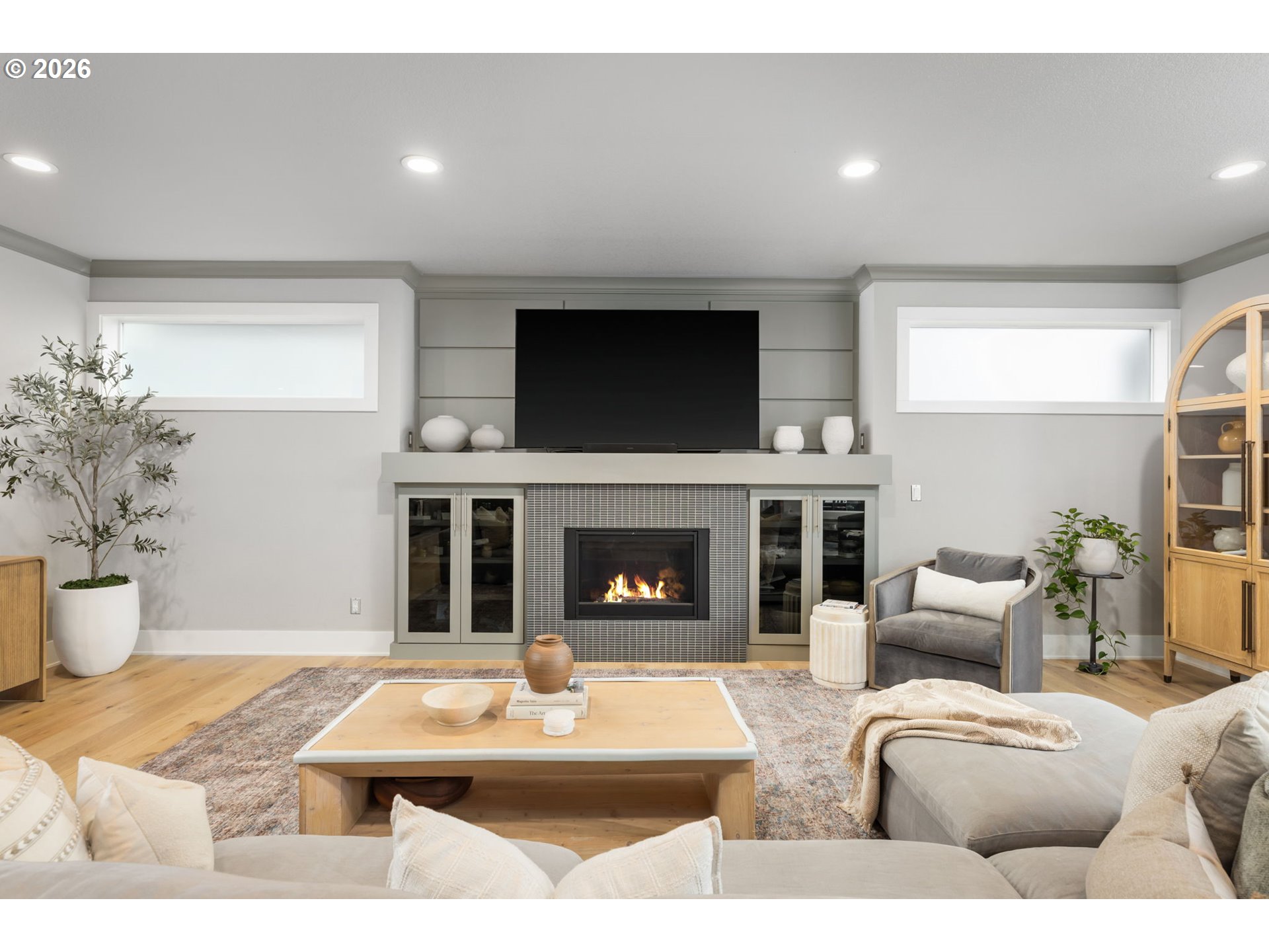 2025 North Alberta Street Portland, OR 97217 - Photo 12 of 48 a living room with furniture a fireplace and a flat screen tv