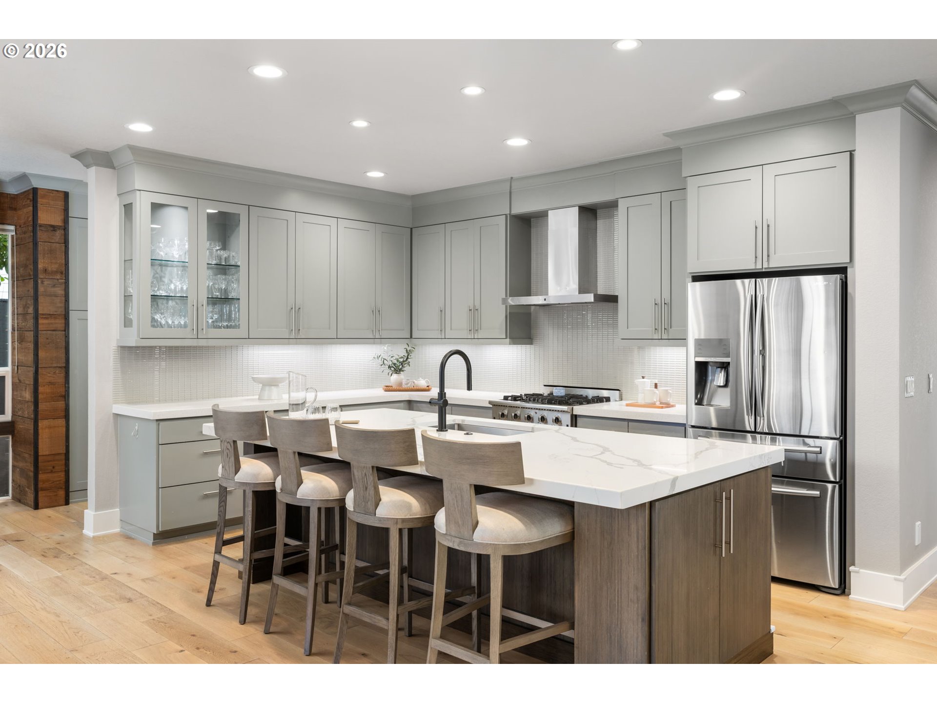 2025 North Alberta Street Portland, OR 97217 - Photo 17 of 48 a kitchen with stainless steel appliances granite countertop a table chairs sink refrigerator and cabinets
