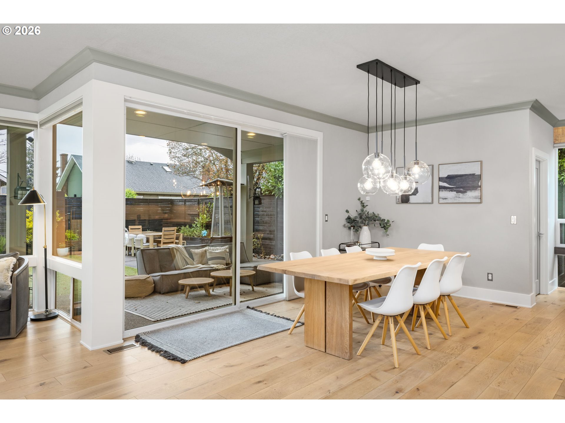 2025 North Alberta Street Portland, OR 97217 - Photo 23 of 48 a dining room with furniture a chandelier and wooden floor