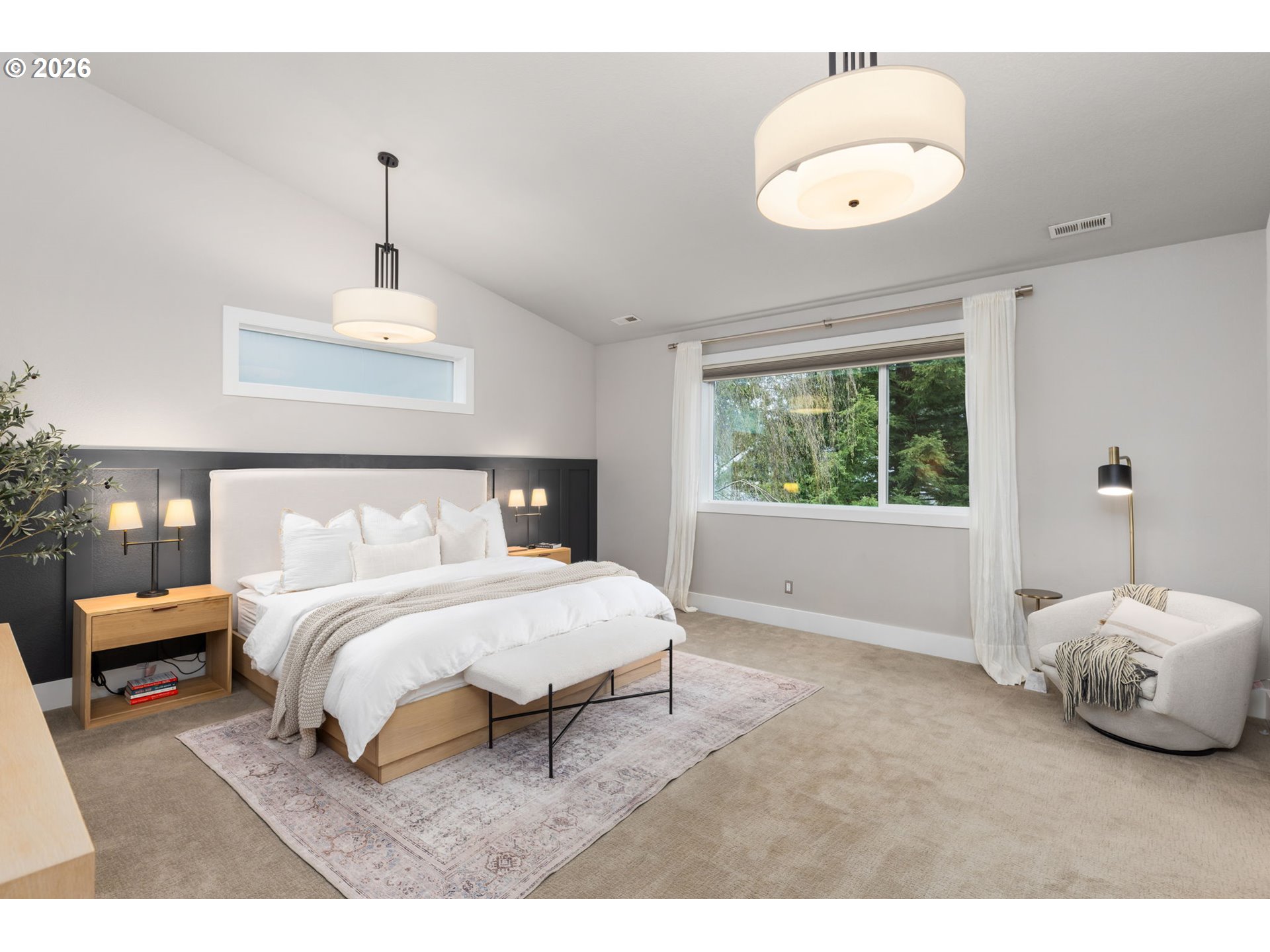 2025 North Alberta Street Portland, OR 97217 - Photo 29 of 48 a bedroom with a bed and a chandelier