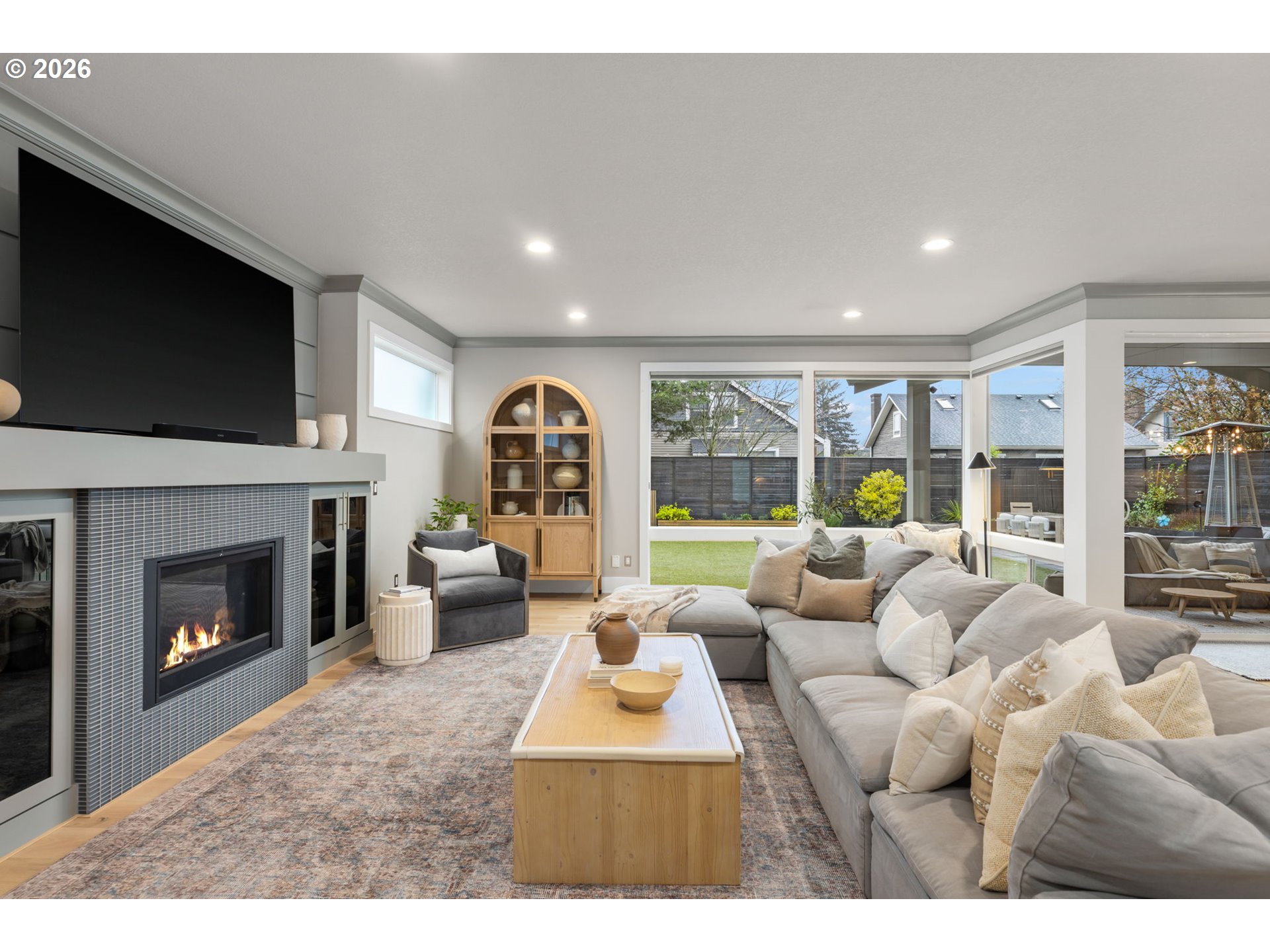 2025 North Alberta Street Portland, OR 97217 - Photo 9 of 48 a living room with furniture a fireplace and a flat screen tv