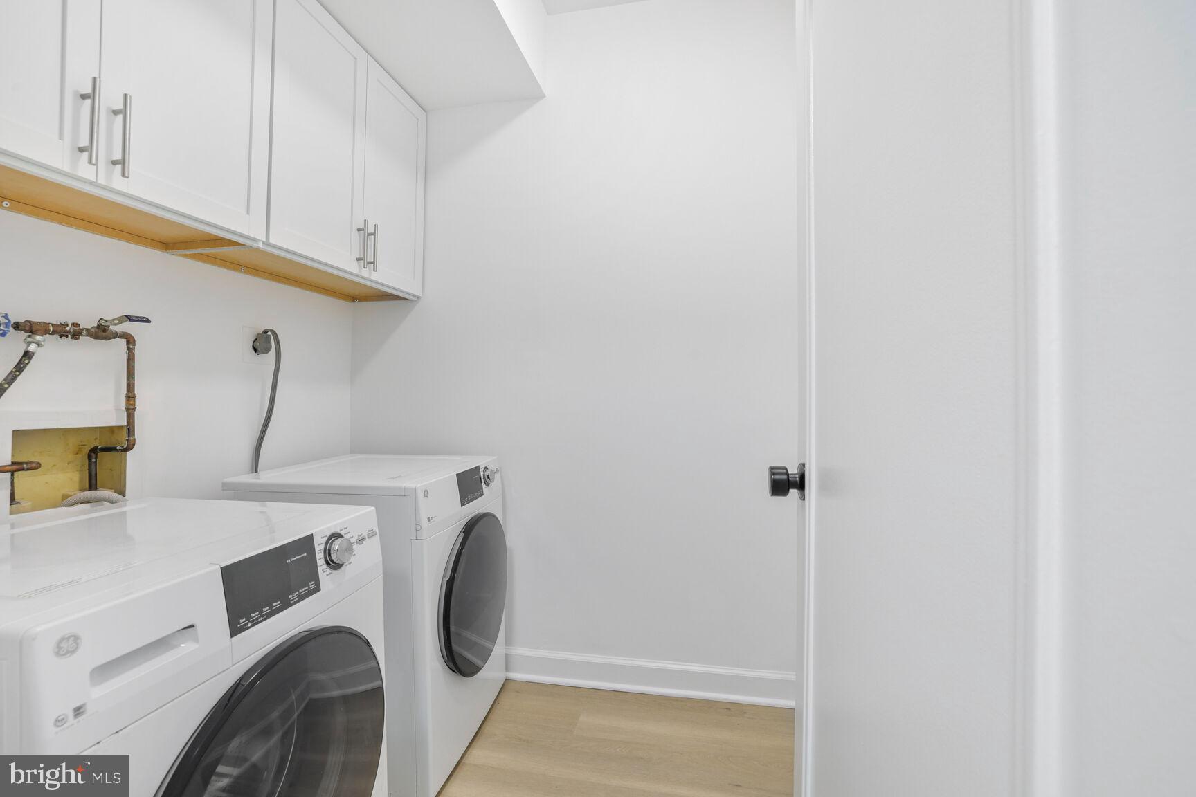 4550 North Park Avenue, Unit 707 Chevy Chase, MD 20815 - Photo 13 of 15 a utility room with dryer and washer