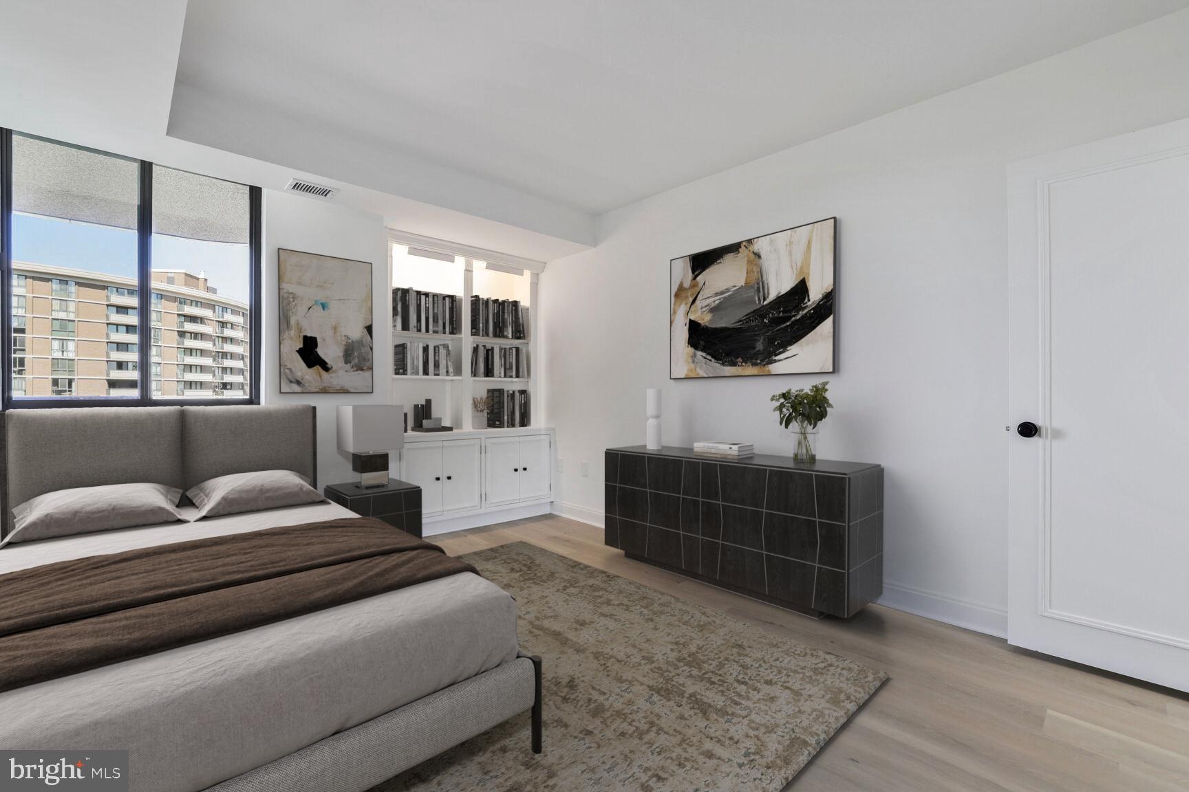 4550 North Park Avenue, Unit 707 Chevy Chase, MD 20815 - Photo 10 of 15 a living room with furniture and a flat screen tv