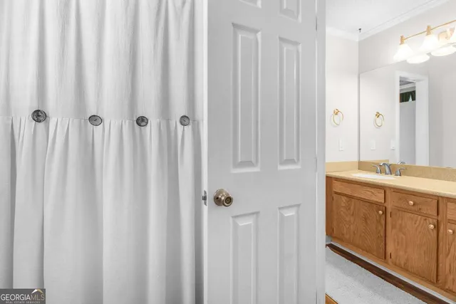 a bathroom with a double vanity sink and mirror