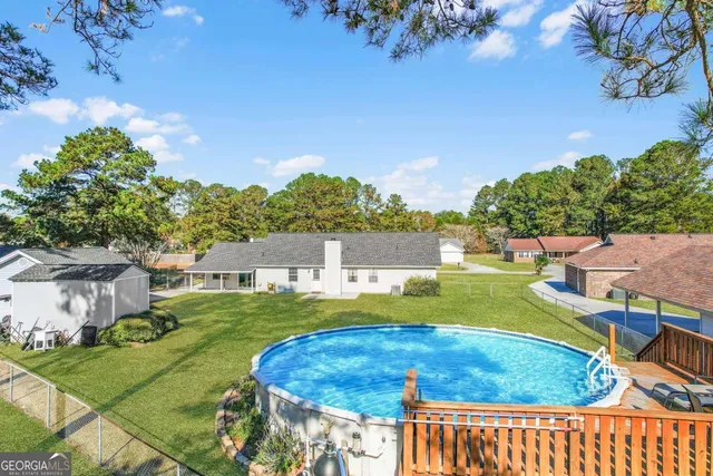a view of a swimming pool with a patio