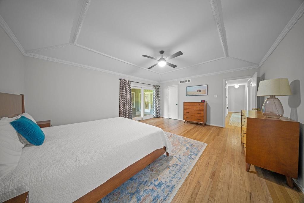 11714 El Hara Circle Dallas, TX 75230 - Photo 19 of 40 a bedroom with a bed and window