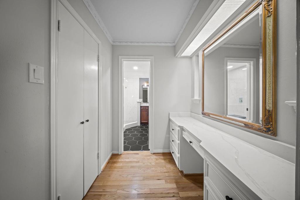 11714 El Hara Circle Dallas, TX 75230 - Photo 20 of 40 a bathroom with a sink and a mirror