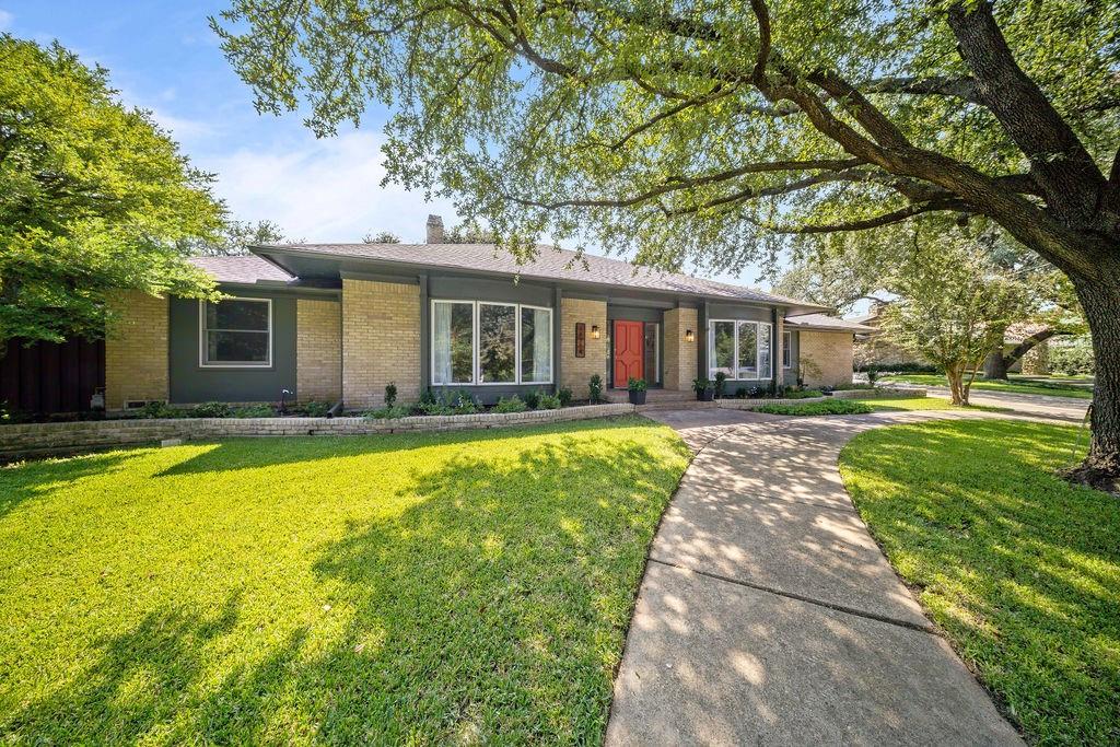 11714 El Hara Circle Dallas, TX 75230 - Photo 2 of 40 a front view of house with yard and green space
