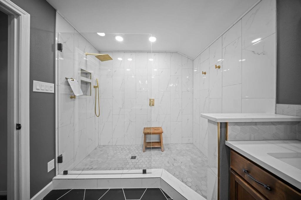 11714 El Hara Circle Dallas, TX 75230 - Photo 22 of 40 a bathroom with a shower and a sink