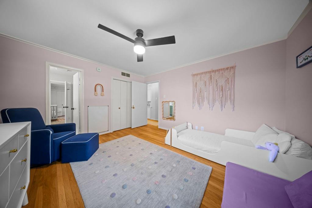 11714 El Hara Circle Dallas, TX 75230 - Photo 24 of 40 a bedroom with a bed and a chandelier