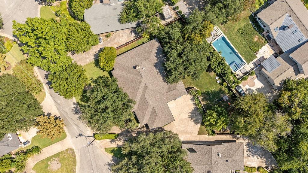 11714 El Hara Circle Dallas, TX 75230 - Photo 37 of 40 an aerial view of a house with a yard and garden