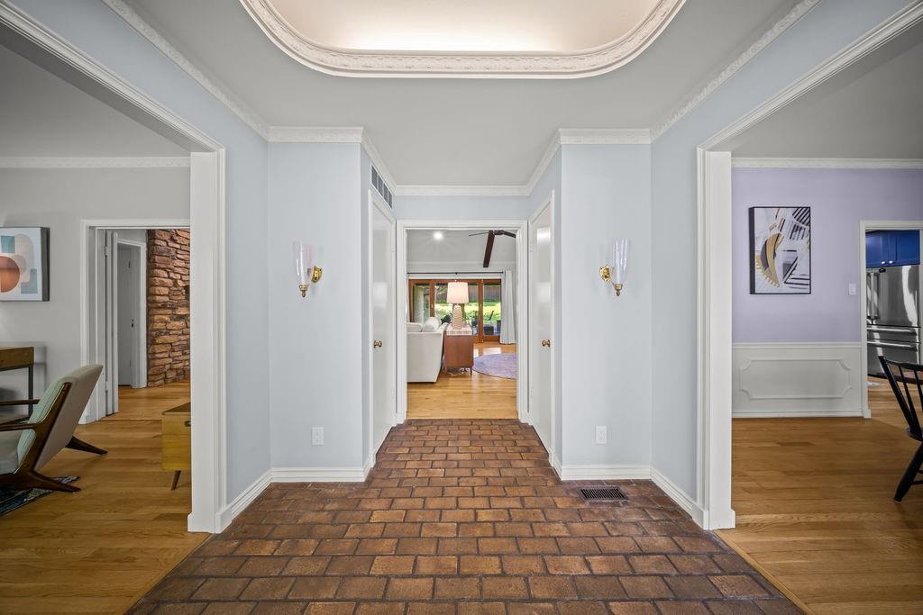 11714 El Hara Circle Dallas, TX 75230 - Photo 4 of 40 a view of a hallway view with wooden floor and living room