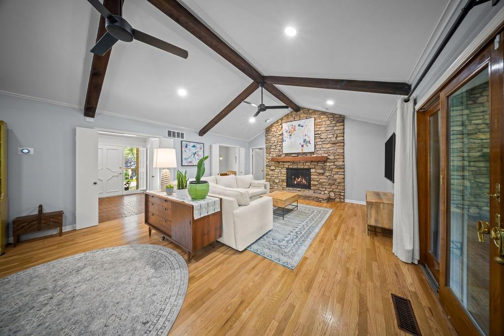 11714 El Hara Circle Dallas, TX 75230 - Photo 7 of 40 a living room with furniture and a fireplace