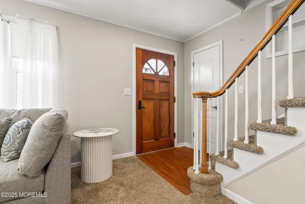 a spacious bathroom with a toilet sink and a mirror