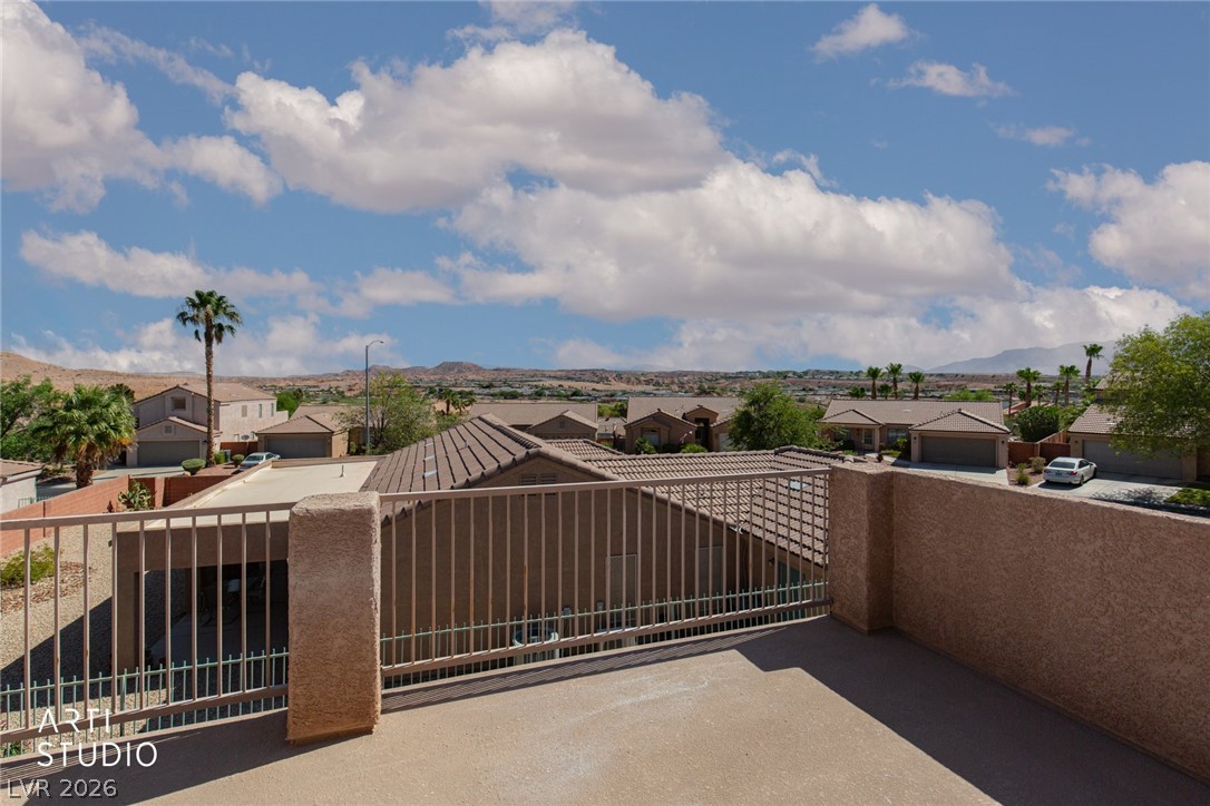 387 Silver Road Mesquite, NV 89027 - Photo 33 of 46 Panoramic mountain and neighborhood vistas unfold from this concrete balcony with classic stucco railings.
