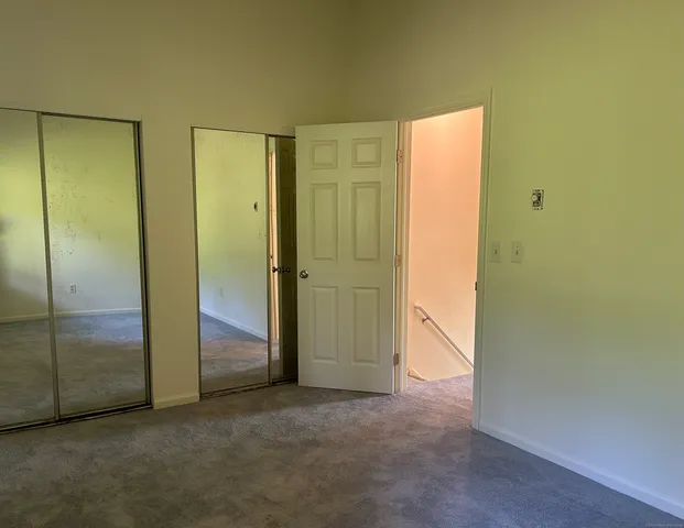 an empty room with a ceiling fan