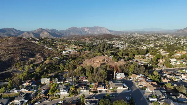 an aerial view of residential house and car parked