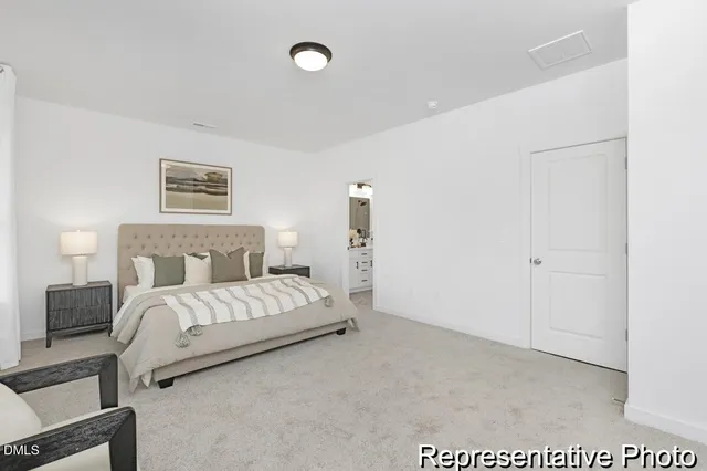 a bed room with a bed and a night stand