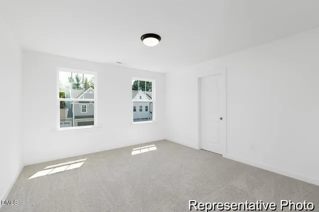 a view of an empty room with windows