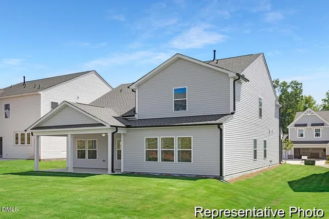 a front view of a house with a yard and porch