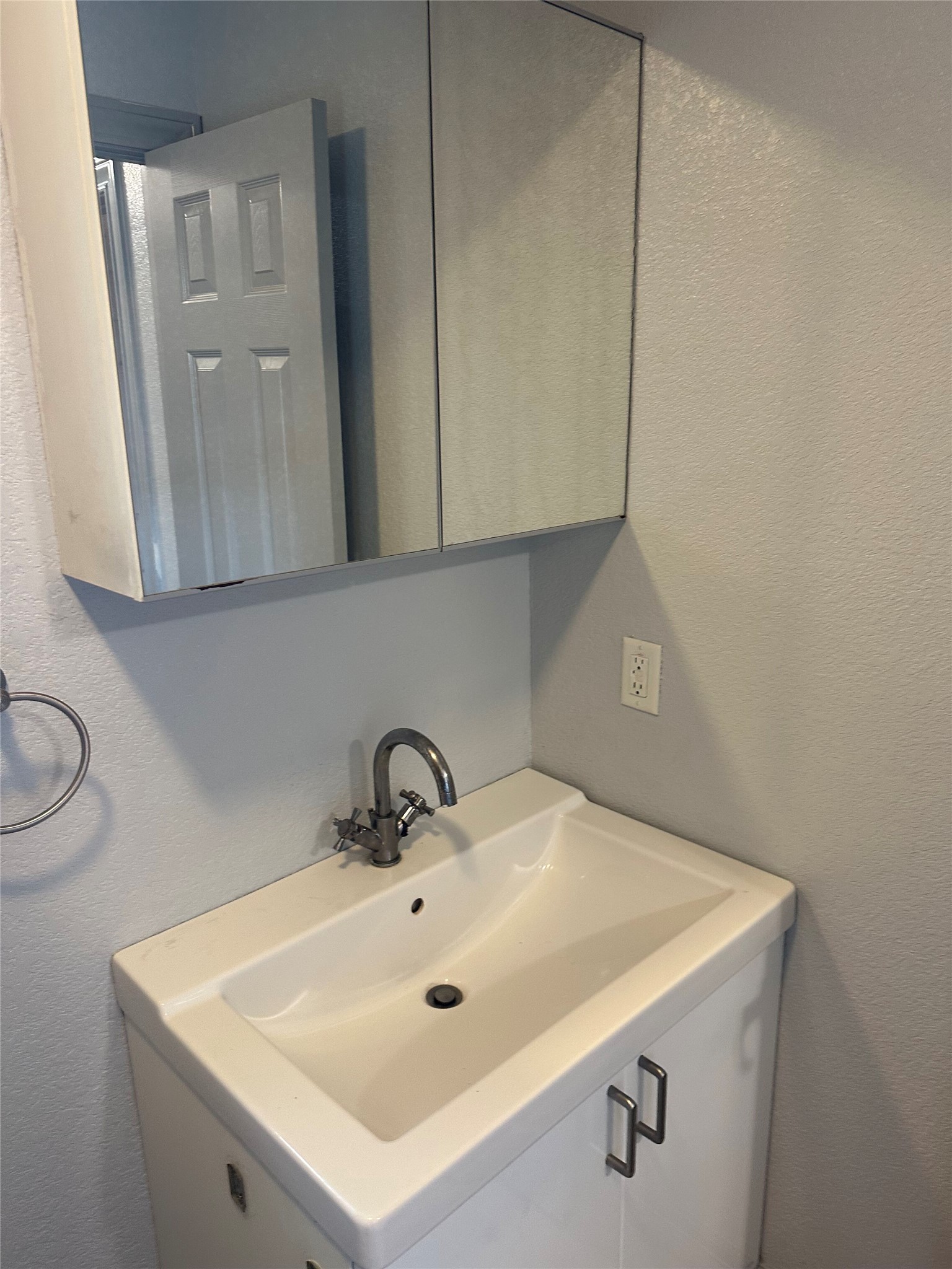 2743 Maple Tree Road, Unit A New Braunfels, TX 78130 - Photo 14 of 18 Bathroom with a textured wall and vanity