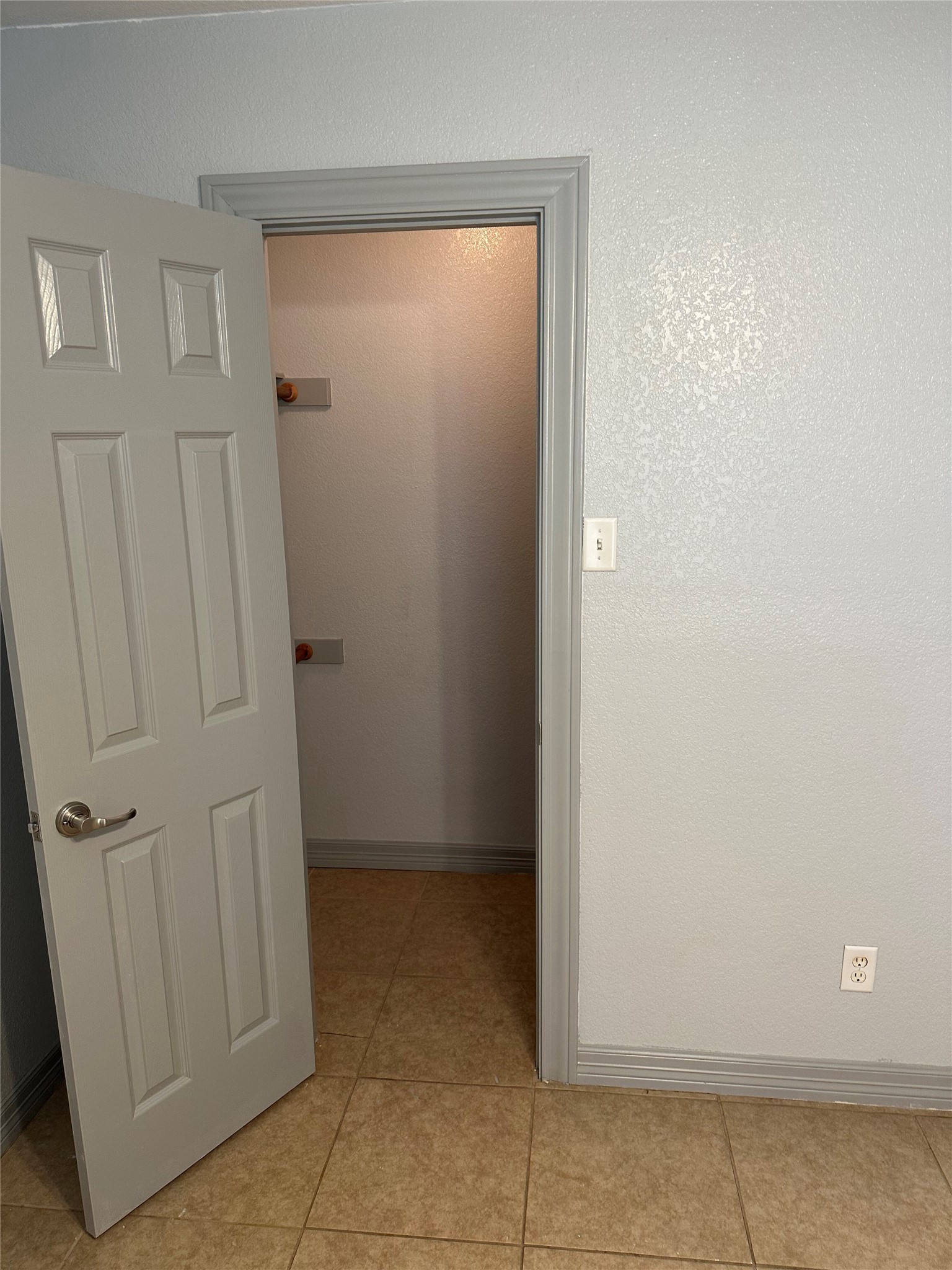 2743 Maple Tree Road, Unit A New Braunfels, TX 78130 - Photo 5 of 18 Hall featuring baseboards and light tile patterned flooring