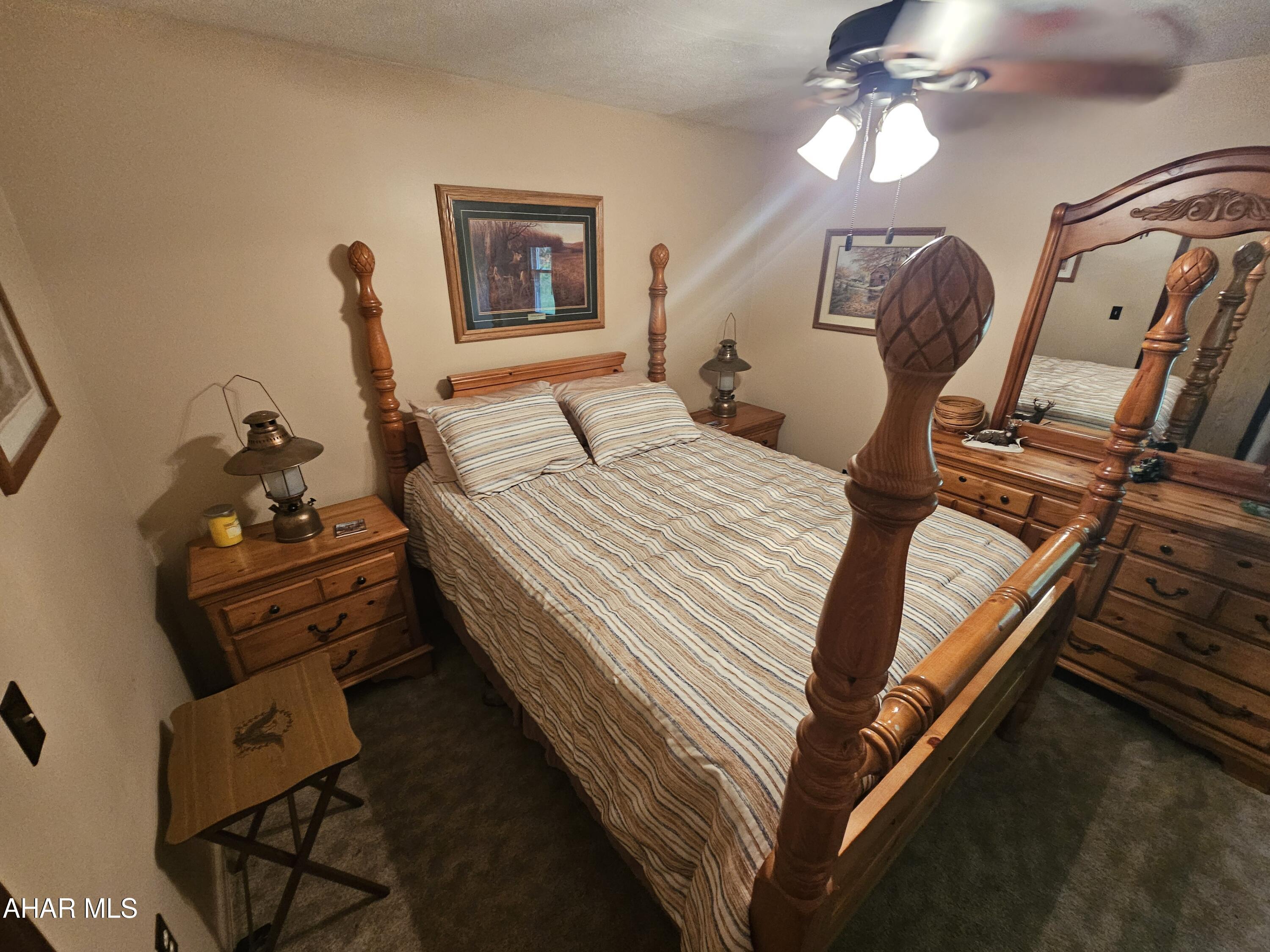 207 Kendrick Lane Flinton, PA 16640 - Photo 14 of 30 a bedroom with bed and a chandelier