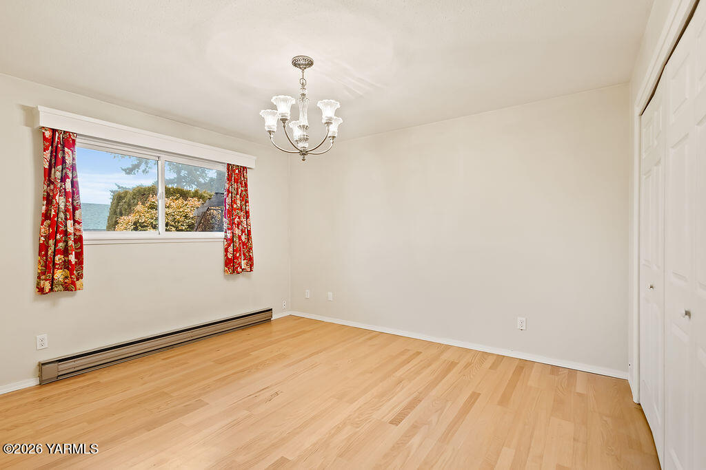 7610 Summitview Avenue, Unit 11 Yakima, WA 98908 - Photo 16 of 20 a view of empty room with wooden floor