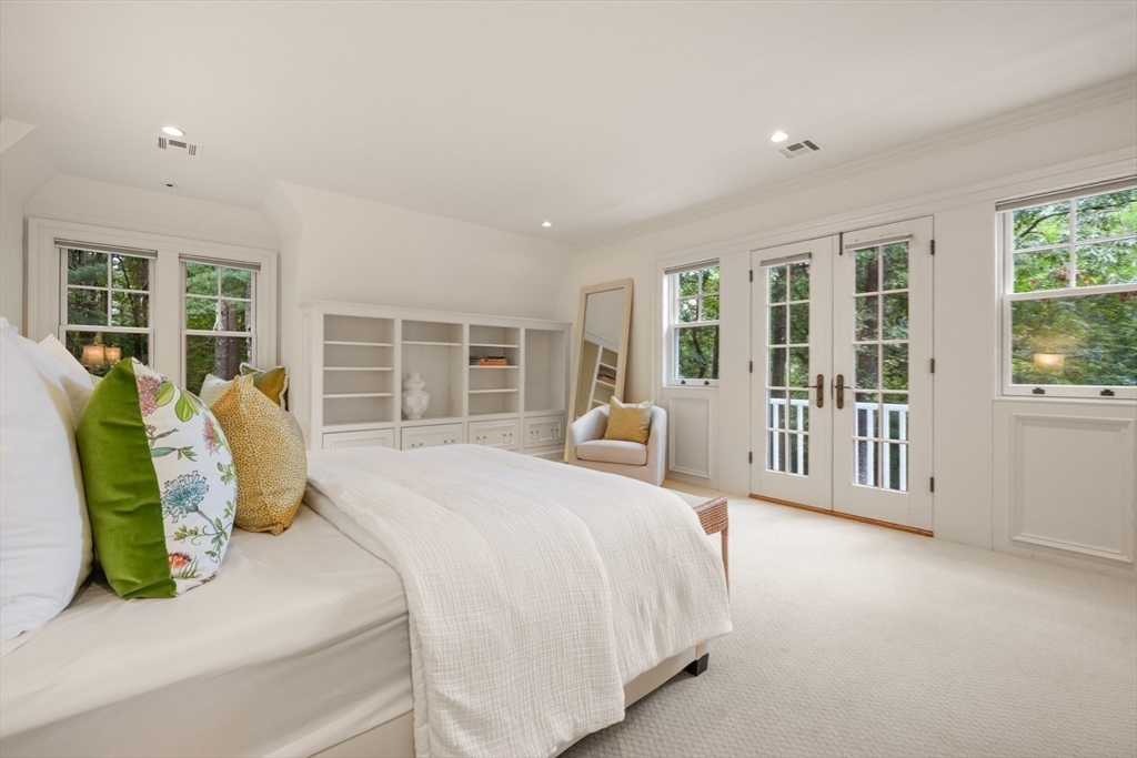 121 Livingston Road Wellesley, MA 02482 - Photo 19 of 42 a bed sitting in a spacious bedroom next to a large window