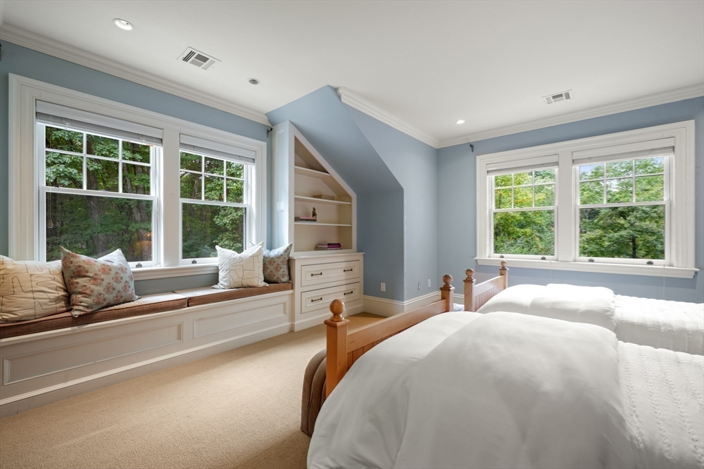121 Livingston Road Wellesley, MA 02482 - Photo 21 of 42 a spacious bedroom with a large bed and a large window