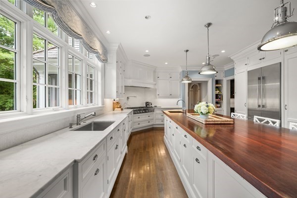 121 Livingston Road Wellesley, MA 02482 - Photo 8 of 42 a kitchen with stainless steel appliances granite countertop a lot of counter space and wooden floors