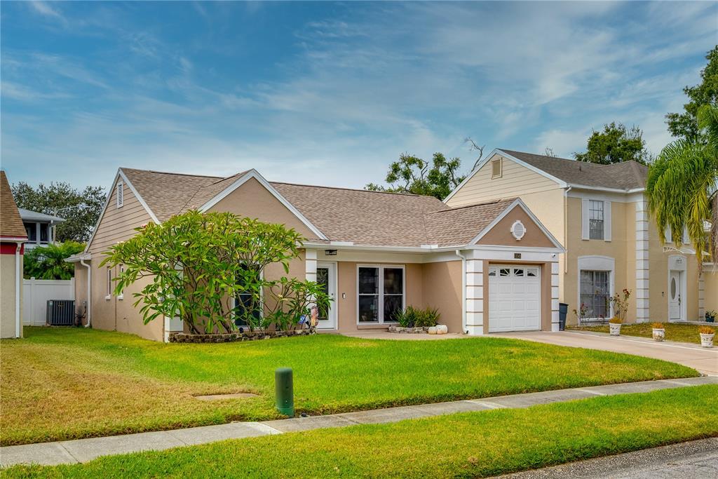 12142 77th Street Largo, FL 33773 - Photo 1 of 1 a front view of a house with a yard
