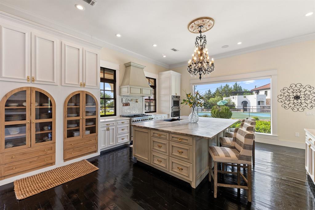 124 Private Road 2202 Decatur, TX 76234 - Photo 11 of 40 a kitchen with stainless steel appliances granite countertop a kitchen island hardwood floor and a sink