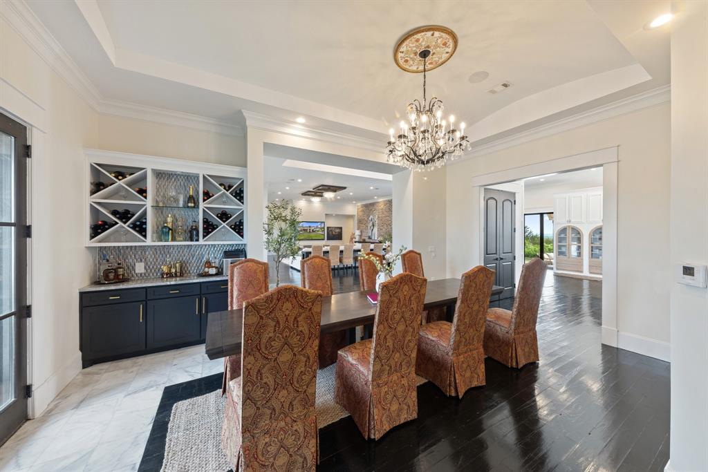 124 Private Road 2202 Decatur, TX 76234 - Photo 13 of 40 a view of a dining room with furniture and chandelier