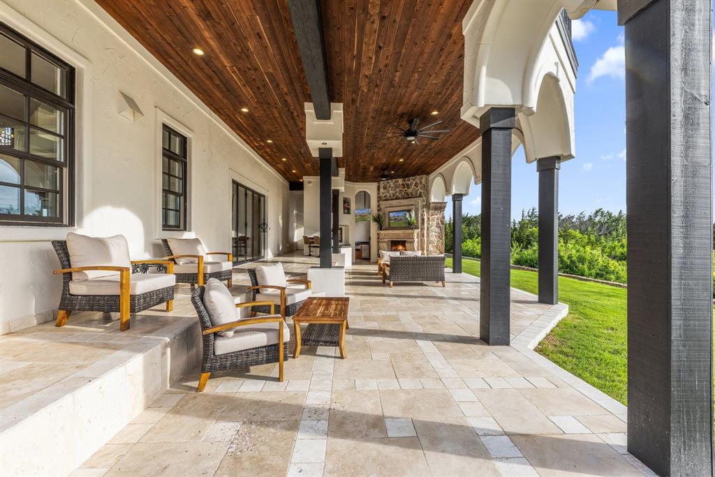 124 Private Road 2202 Decatur, TX 76234 - Photo 25 of 40 a view of a patio with dining table and chairs with plants