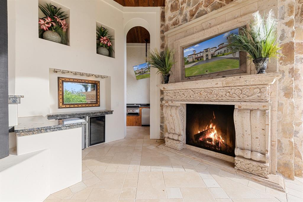 124 Private Road 2202 Decatur, TX 76234 - Photo 26 of 40 a living room with furniture a fireplace and a flat screen tv