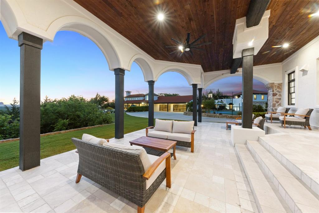 124 Private Road 2202 Decatur, TX 76234 - Photo 27 of 40 a view of a patio with couches table and chairs with wooden floor and fence